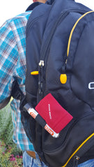 Photo of the clip n clean accessory fastened to a hiking backpack with the Copper Rescue wand